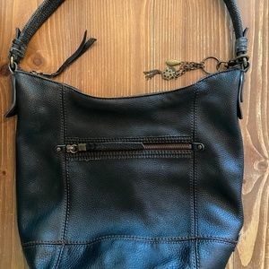 The Sak brand black leather purse